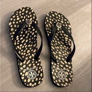 Size 8.5 Tory Burch black and cram flip flops. Good used condition. Great deal!